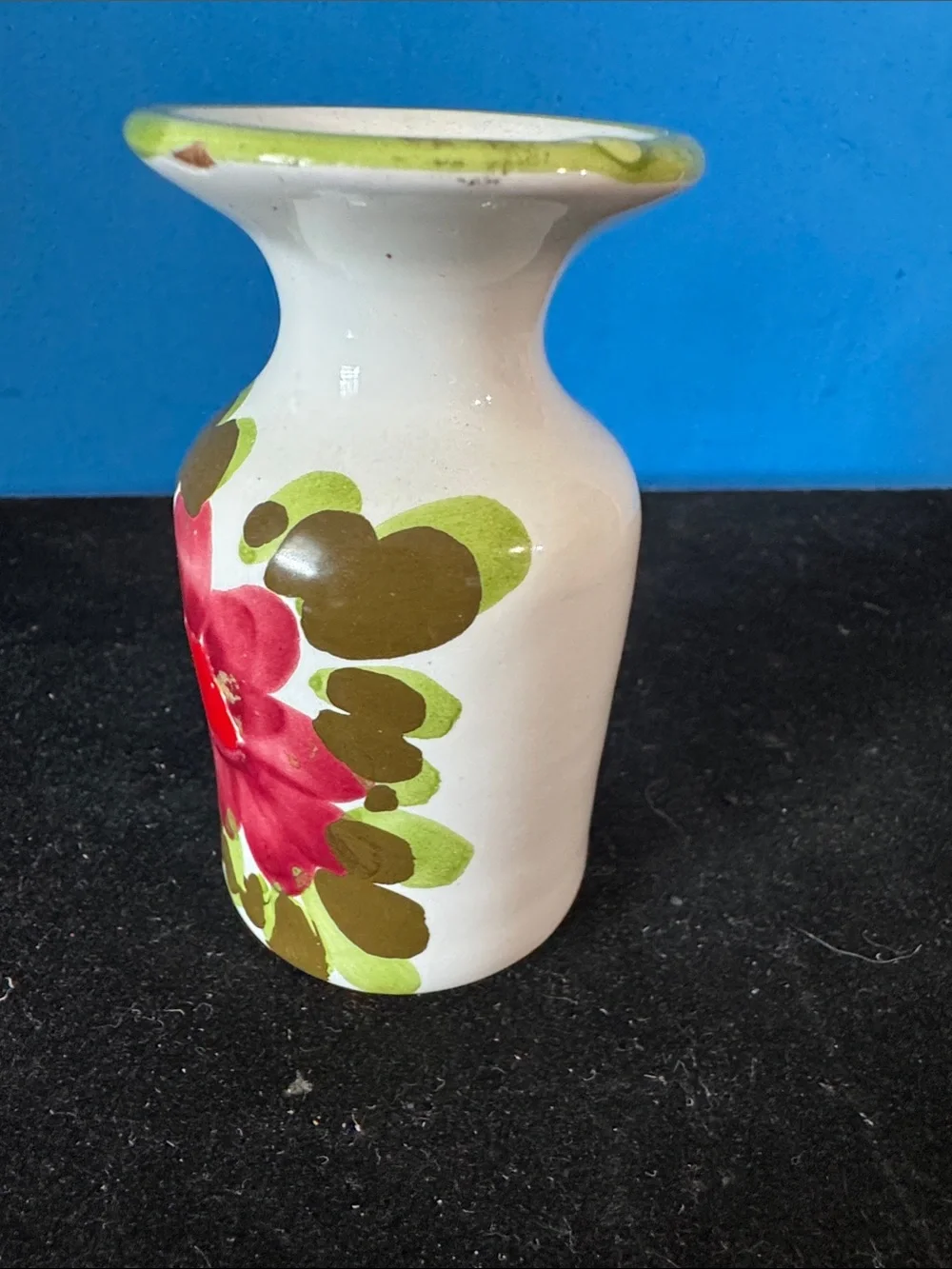 vintage ceramic vase features hand-painted floral motifs typical of mid-century